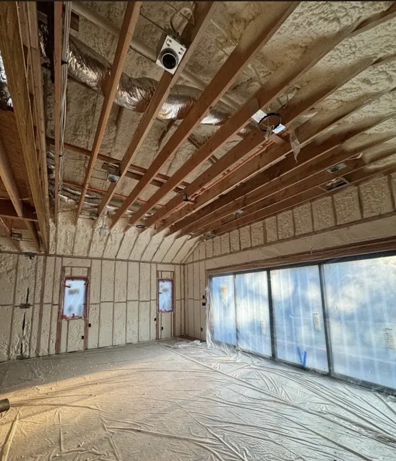 Interior walls and ceiling insulated with spray foam during new construction in Wells